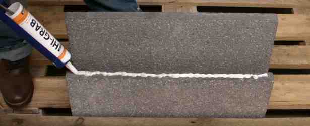 High grab adhesive on concrete. Demonstration of high grab adhesive using heavy concrete blocks.